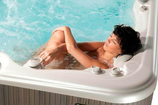Arctic Spas mom relaxes in a hot tub